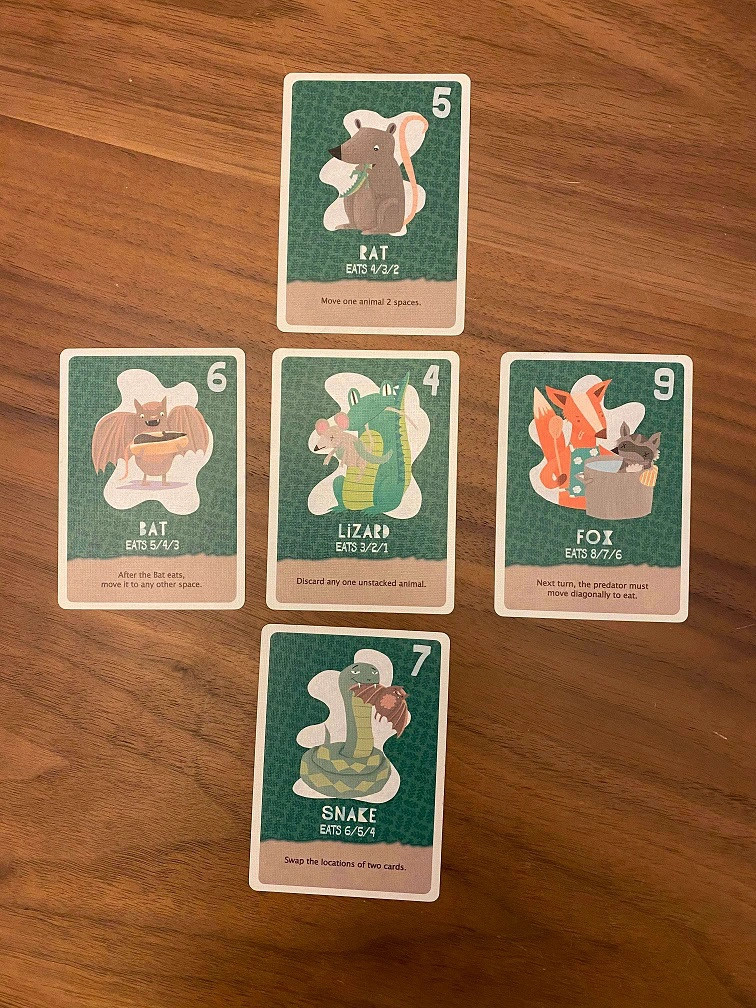 The pile on 5 land creatures are arranged in a "plus" shape where 4 creatures are adjacent to the central one.