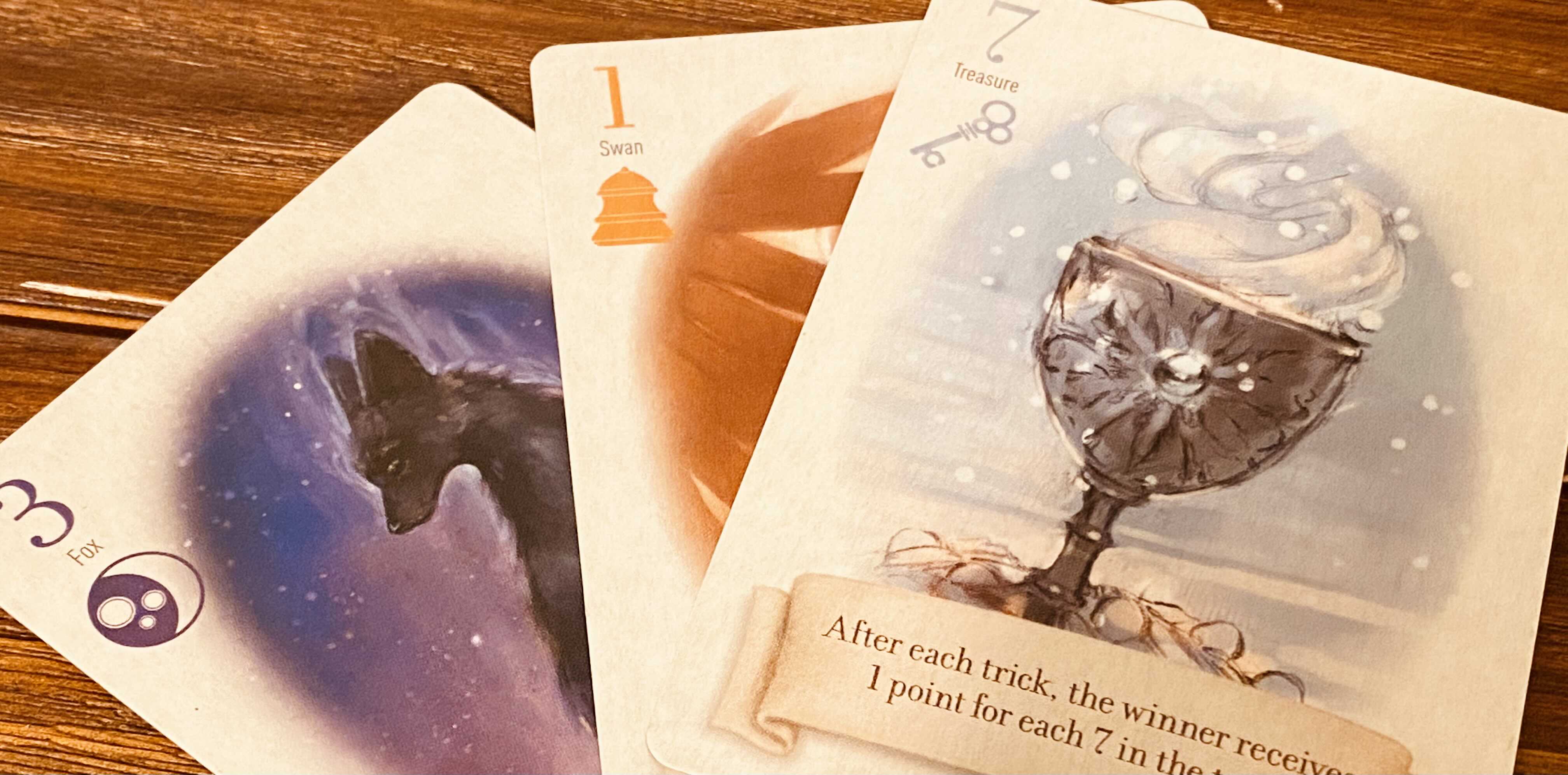 The Special Cards From left to right, the moon fox (3), the bell swan (1), and the key chalice (7)